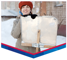 A woman holding a shovel.
