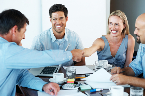 a group of people doing business.