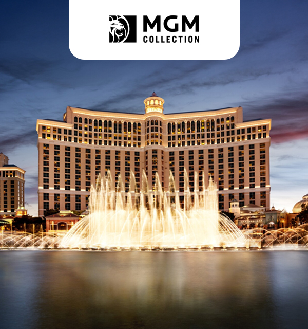 The Bellagio Hotel with its illuminated fountains at dusk, surrounded by water. The MGM Collection logo is displayed at the top.