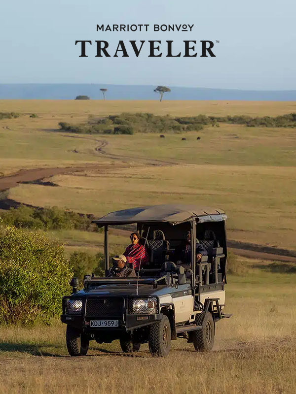 A person driving a safari jeep at JW Marriott Masai Mara Lodge.