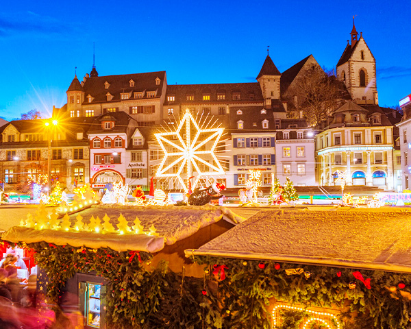 View of European town decorated with bright holiday lights.