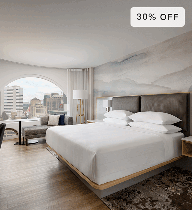 Animated gif of bare Marriott Hotels mattress and made bed in deecorated room