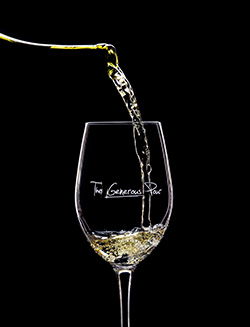 White wine pouring into wine glass