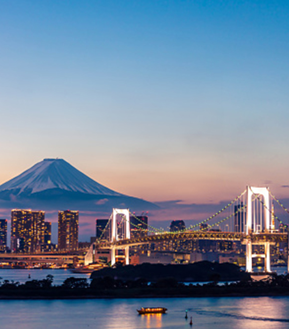 Urban sunset view with Rainbow bridge and Mount Fuji, colorful houseboats, in Tokyo Odaiba, Japan