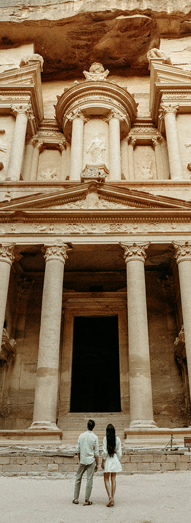 A man and woman sightseeing in Amman.
